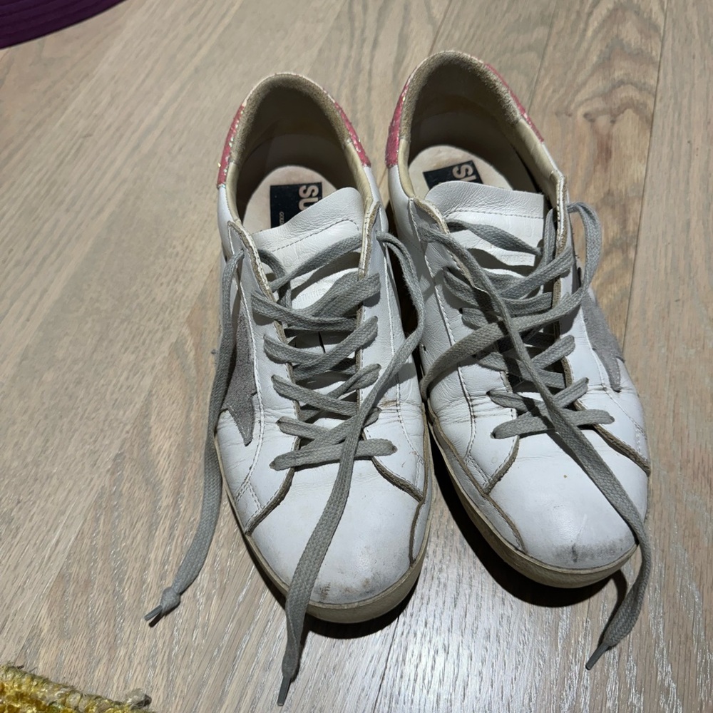 white golden goose sneakers with pink glitter back